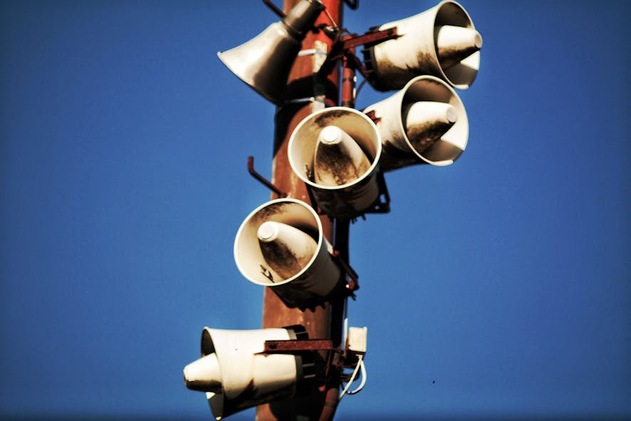 Megaphone Speakers on Wooden Post